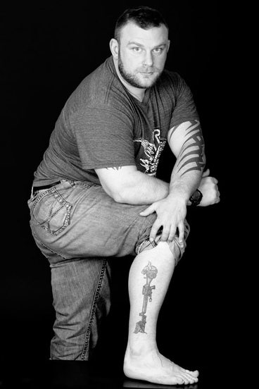 Man Poses with AR-15 tattoo