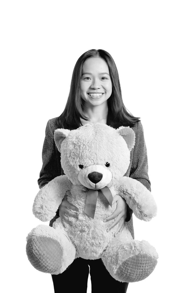 Media studies professor Natalie Ngai holding a kawaii plushie.