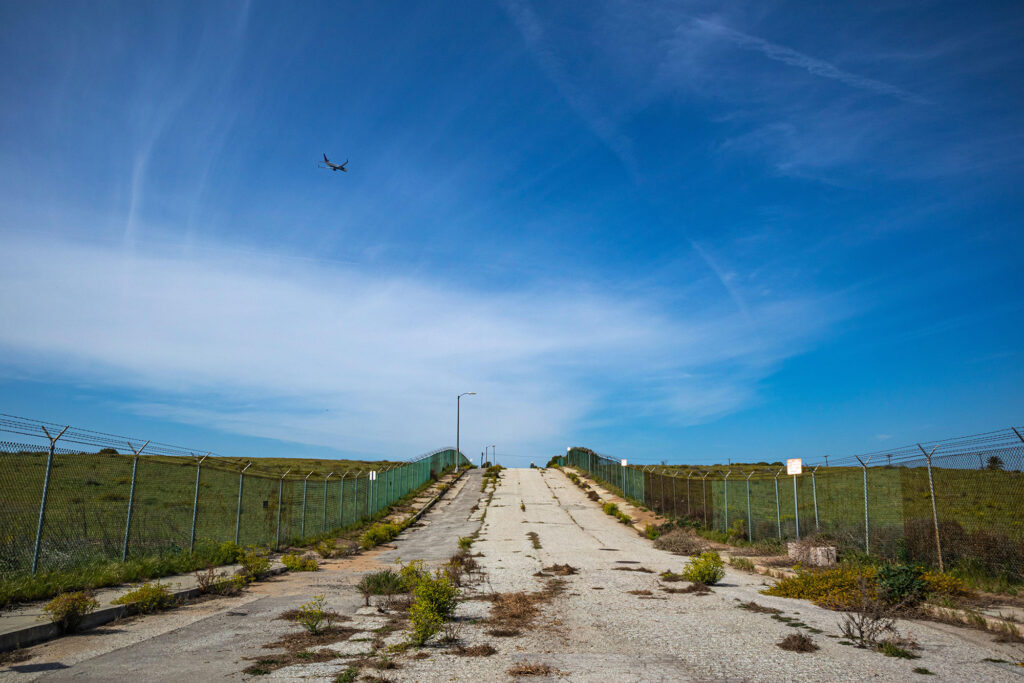 Abandoned and fenced road in the Los Angeles ghost town of Surfridge.
